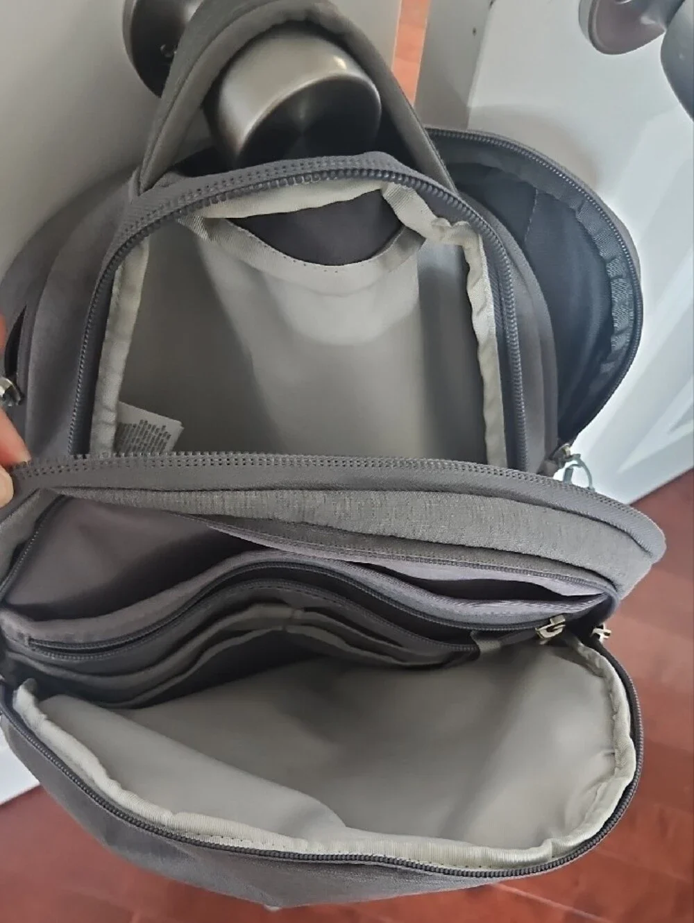 The North Face Grey Backpack with Light Blue Bungee Cord